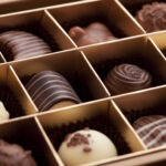 Macro close-up of a gift box of gourmet chocolates.